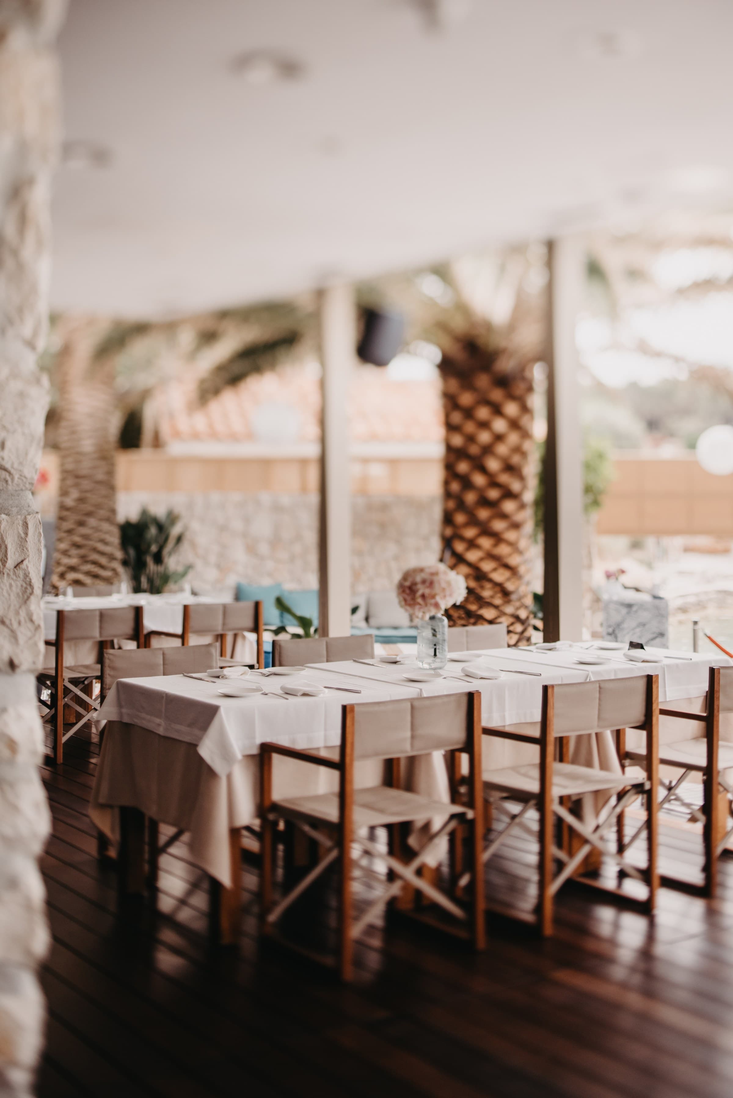 The Zori restaurant dining room between services, stone walls and open terrace