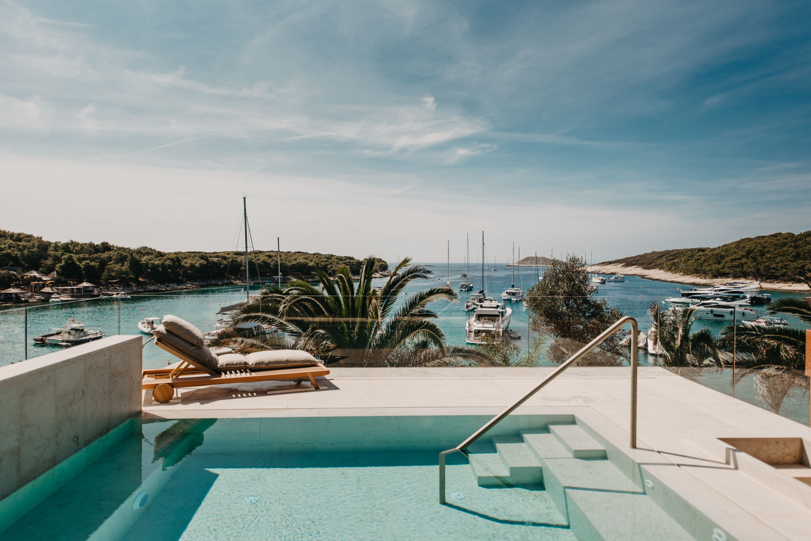 Cloud. Rooftop pool. The whole bay lies below you, and only sky above.